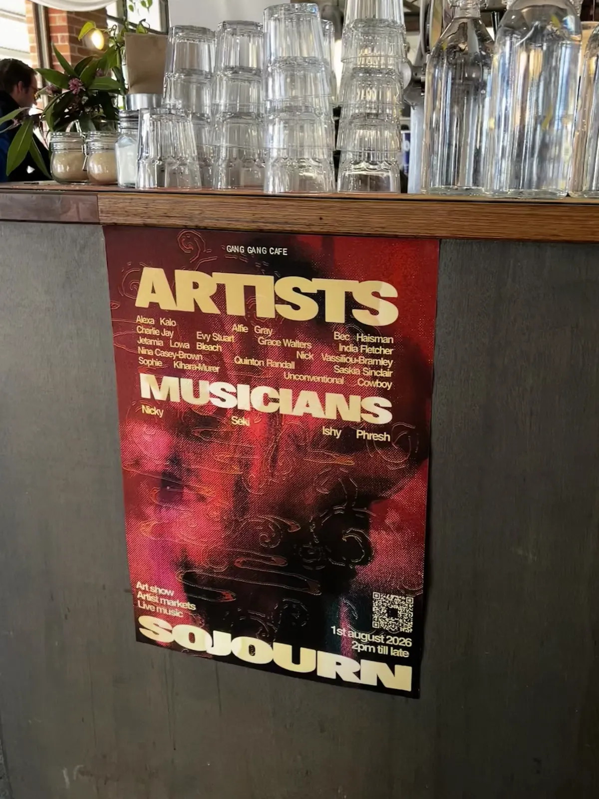 Sojourn artist lineup poster on display at Gang Gang Cafe