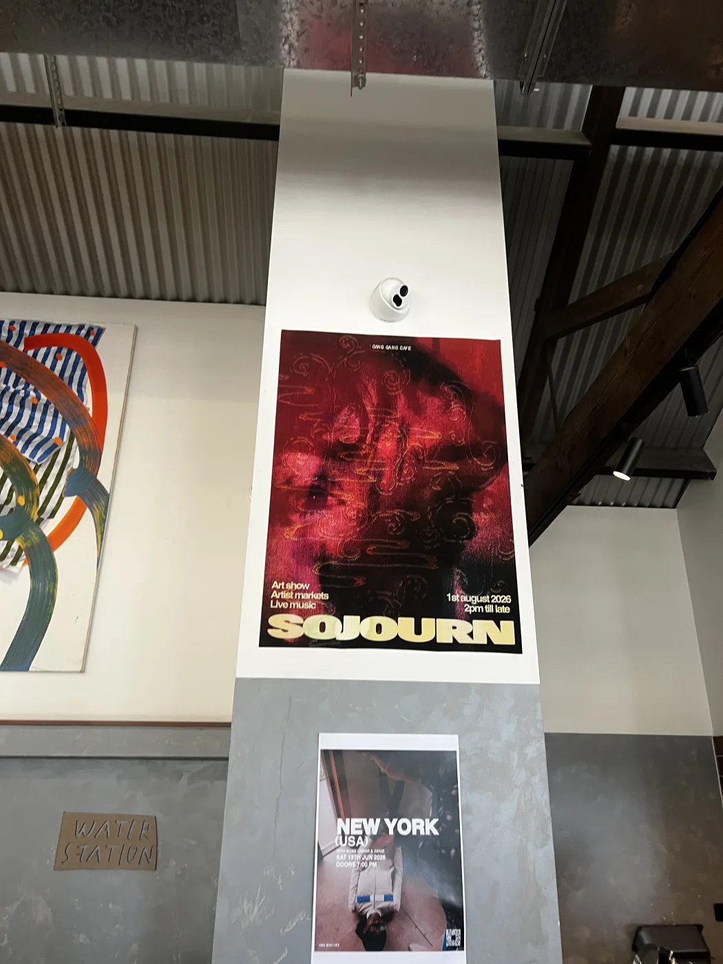 Sojourn poster on display at Gang Gang Cafe